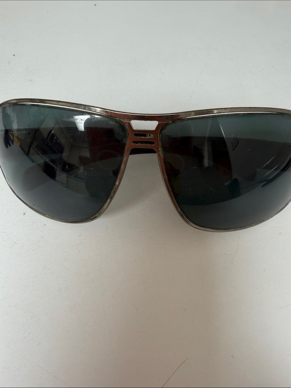 2006
Prada Silver Metal Aviator Sunglasses with Dark Gray Lenses needs nose pad